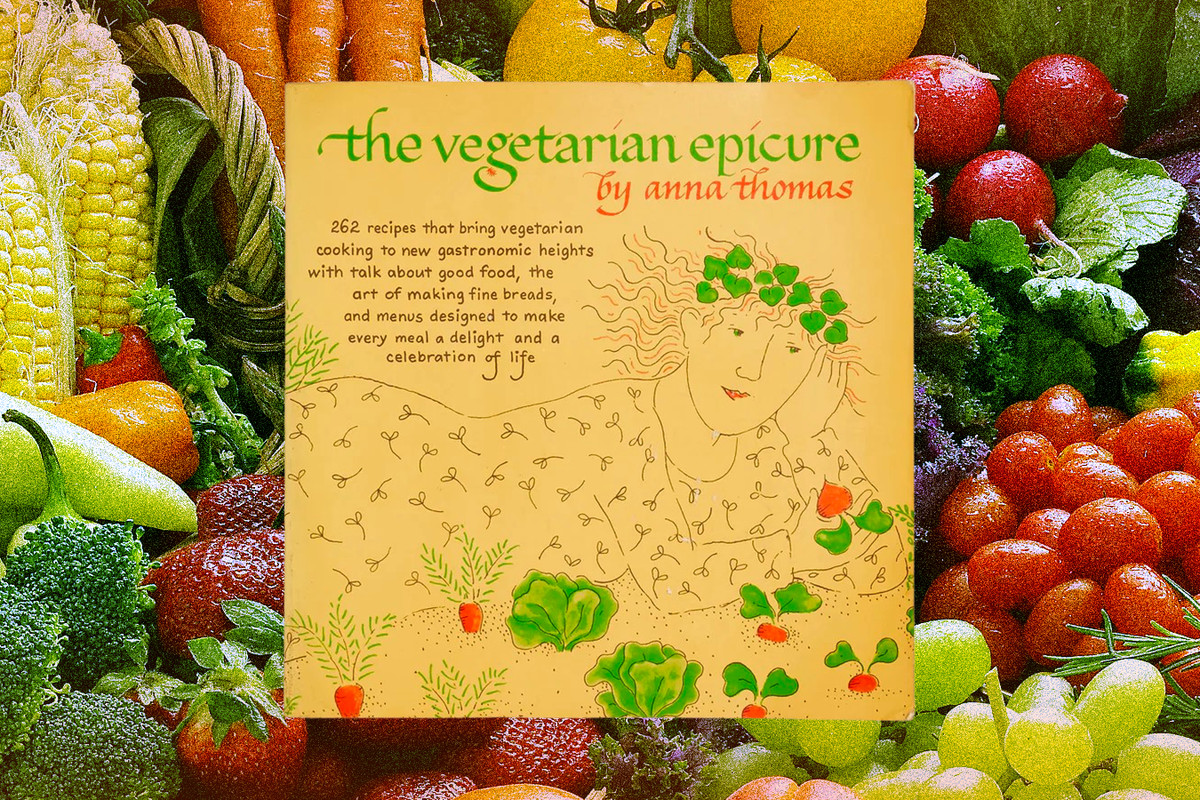 The cover of The Vegetarian Epicure, superimposed over a background of fruit and vegetables.
